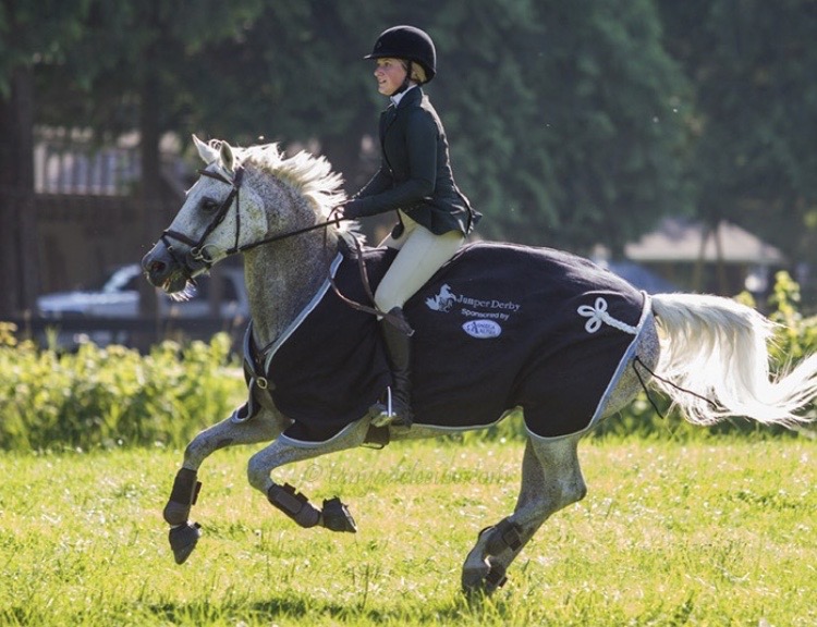 Vanessa Waugh on horseback at a showjumping competition